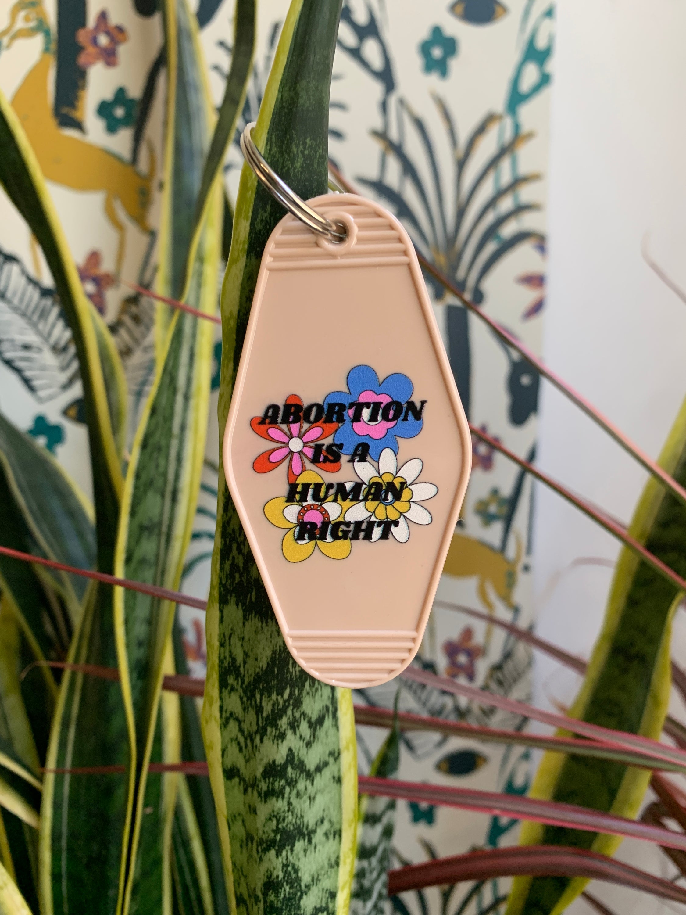 Abortion is a Human Right Keychain in Groovy '70s Flower Print